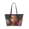 Product image for the essence portrait leather tote featuring a tote bag with the face of a beautiful black lady whose expression emphasizes the essence of beauty and strength